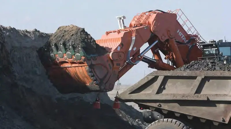 A mining shovel loads a haul truck